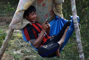 A child reads from a Book Box library in a rural Lao school.