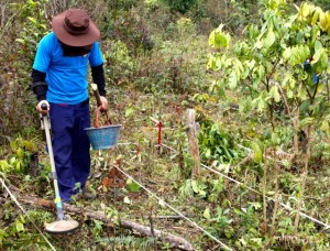 Members of a UXO clearance team set up camp in a Lao village.