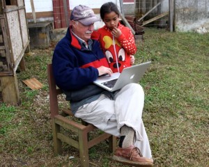 Ten-year-old Nan studies photos of snakes common to Laos to identify the species that bit her five months ago.