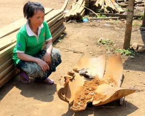 We grew tired of seeing villagers living in harm's way so we arbitrarily broke the impasse.  We destroyed the booster and returned the casing, now safe to sell as scrap, to the family who originally found it.